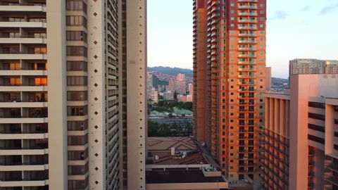 Urban sunset light between high-rise buildings in Honolulu, Golden hour view Stock Footage 305827662