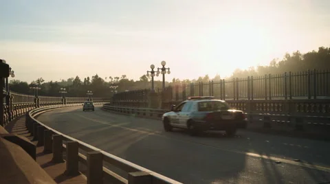 Urban Sunset with Traffic Passing through Shot Stock Footage 68453148