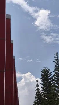 Urban texture with white clouds in the sky Stock Photos