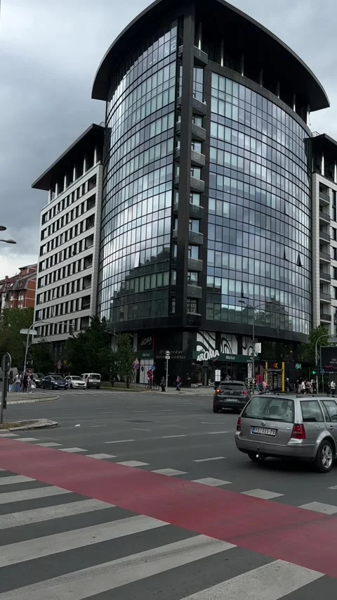 Urban traffic moves through the intersection Stock Footage 346305231