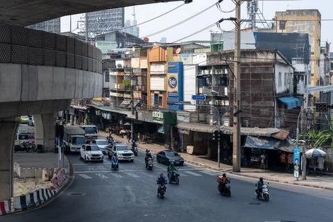 Urban traffic under elevated road in Bangkok Фото