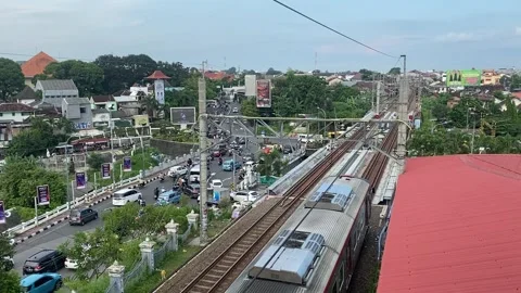 Urban Train Passing Through Busy City Traffic. Stock Footage 307048657