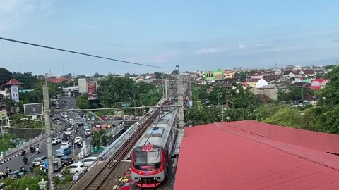Urban Train Passing Through Busy City Traffic Stock Footage 307048665