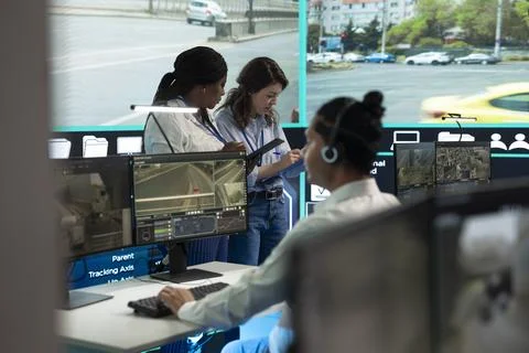 Urban transport specialists analyzing data from roadside traffic sensors Stock Photos