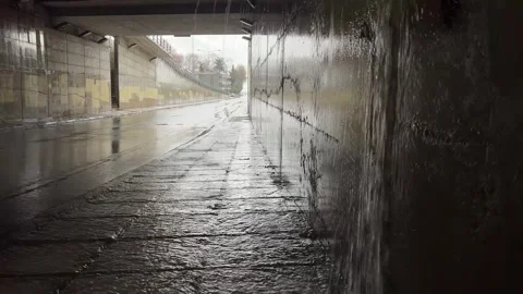 Urban underpass with rainfall: capturing nature's interaction with city arc.. Stock Footage 325522093
