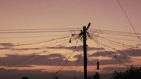 Urban utility pole with tangled wires Stockbeeldmateriaal 318970401