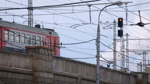 Urban View. Electric Train Crossing the Bridge on Low Speed. Concrete Building. Stock Footage 68620127