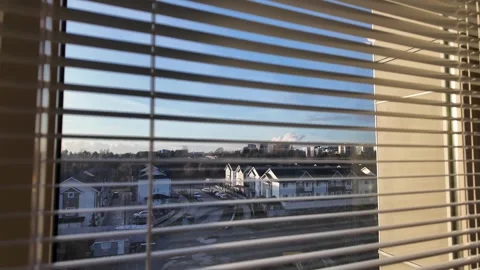 Urban View Through Window Blinds in Bright Daylight Stock Footage 263928446