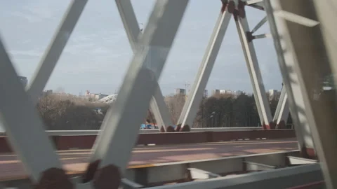 Urban view from train window. Bridge constructions with road with cars Vídeos de archivo 146207539