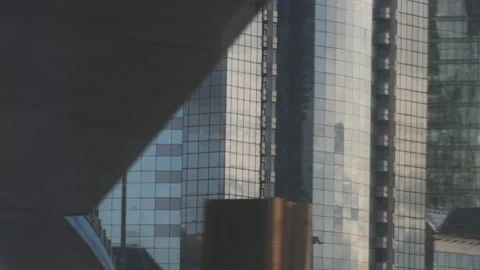 Urban view from train window. Glass skyscrapers moving along. Video stock 134134098