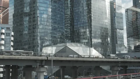 Urban view from train window. Glass skyscrapers moving along. Stock-Footage 143457134