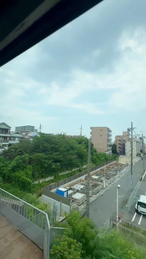 Urban view from train window, passing through residential neighborhood Stock Footage 346710551