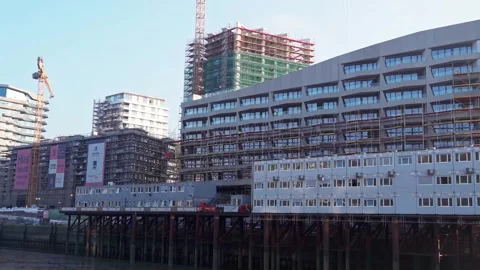 Urban waterfront construction site developing modern buildings Video stock 317439404