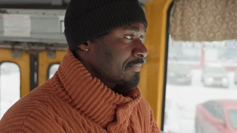Urban winter reflection. Man on bus in winter. Seated individual experiences Stock Footage 338287352