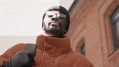 Urban winter scene capturing man with snow and reflections clearly. Detailed Stock Footage 345167772