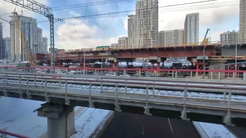 Urbanisation, a view from a train window of the construction of a multi-lane Stock Footage 150200505