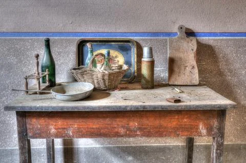 Urbex an old table on which bottles Stock Photos