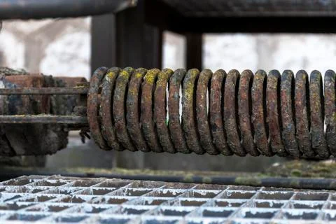 Urbex. Rusty spring of an abandoned train car Stock Photos