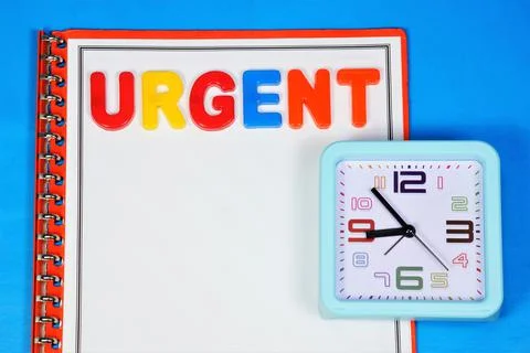 Urgent. Text label on the Planning Notebook. Stock Photos