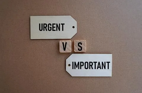 URGENT VS IMPORTANT. Concept of choosing what is more important Stock Photos