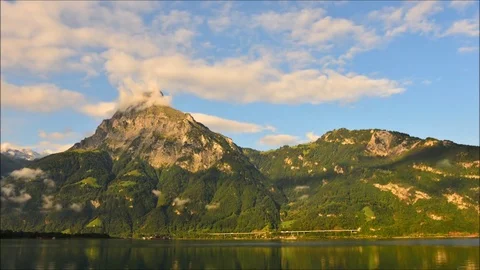 Uri. The rays of the sun in the clouds. Mountain Lake. Stock Footage 74183601