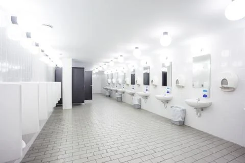Urinal and sink Stock Photos