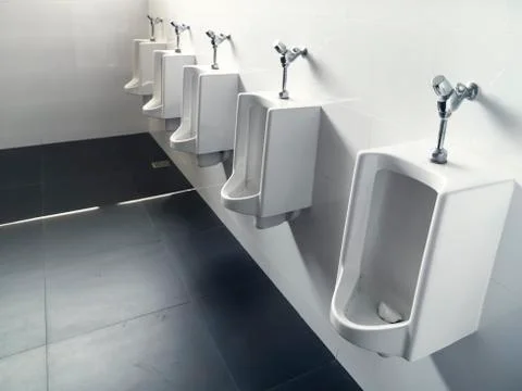 The urinal in the bathroom Stock Photos