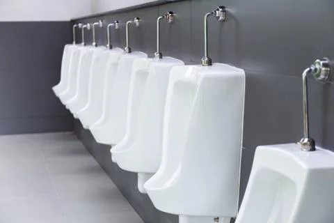 Urinal in the bathroom Stock Photos