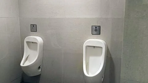 Urinal Bowl With Automatic Flush Stock Photos