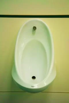 Urinal in a publc convenience Stock Photos