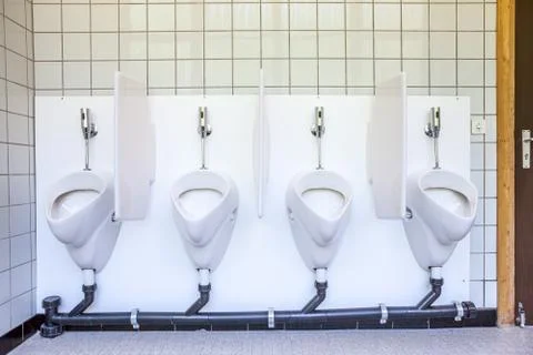Urinal on the wall Stock Photos