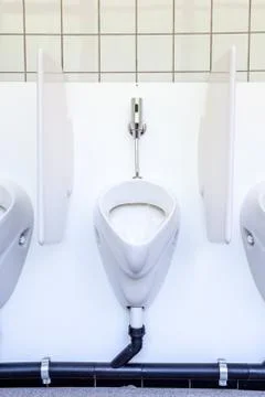 Urinal on the wall Stock Photos