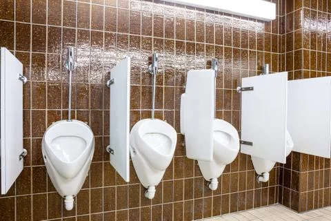 Urinal on the wall Stock Photos