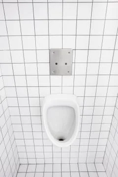 Urinal on the wall Stock Photos