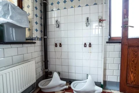 Urinal on the wall Stock Photos