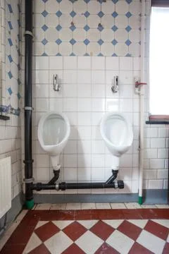 Urinal on the wall Stock Photos