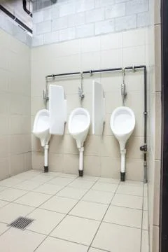 Urinal on the wall Stock Photos