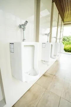 Urinal on the wall Stock Photos