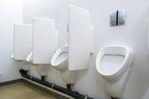 Urinal on the wall Stock Photos