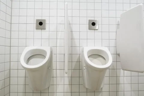 Urinal on the wall Stock Photos