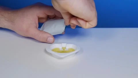 Urine sample collection with absorbent test stripe for home-testing Video stock 240841696