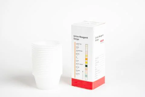 Urine Strips Box And A Stack Of Plastic Containers Stock Photos