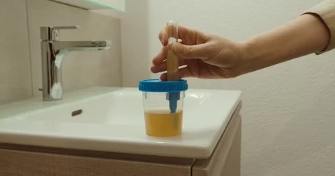 Urine Test Sample Collection – Medical Check at Bathroom Sink Stock Footage 334361126