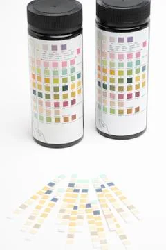 Urine Test Strips &amp; Bottles With Guide Markers Stock Photos