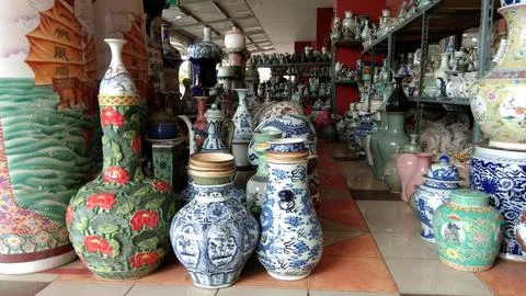 Urns, ceramic jugs placed in front of the entrance of a mall. Stock Photos