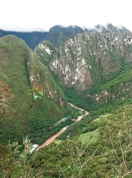 The Urubamba river between deep leafy mountains Stock Photos