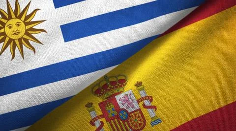 Uruguay and Spain two flags textile cloth, fabric texture Stock Illustration