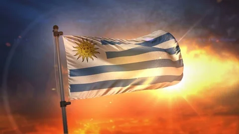 Uruguay Flag Backlit At Beautiful Sunrise Loop Slow Motion 4K Stock Footage 76911929