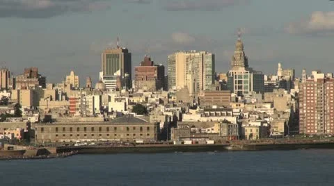 Uruguay Montevideo waterway passing skyline and esplanade Stock Footage