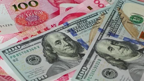 US 100 dollar banknotes falling on Chinese yuan (CNY) bills Stock Footage 336663709